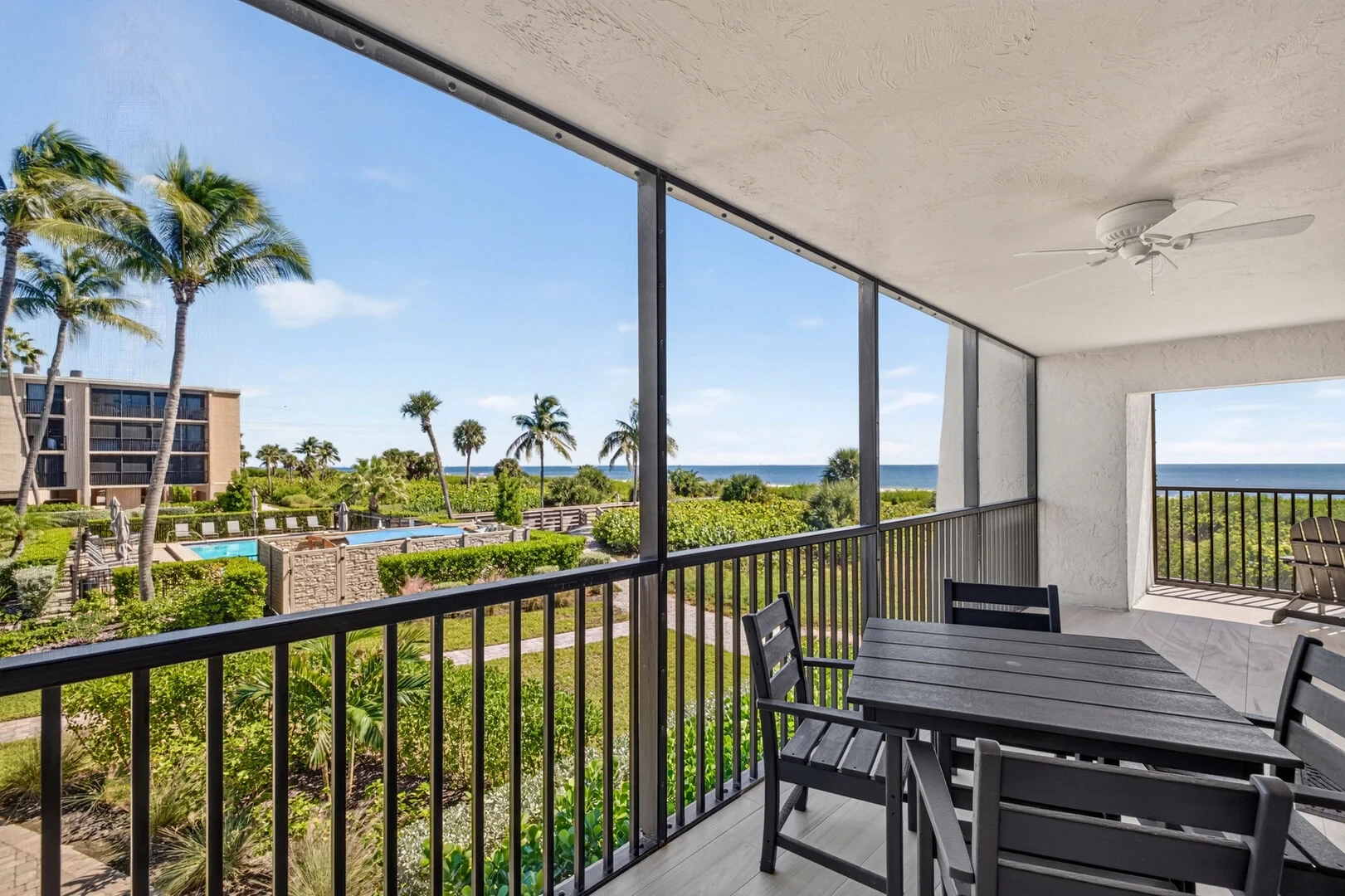 Screened lanai with pool and Gulf views